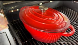 gefuellte paprika im geschlossenen braeter schmoren